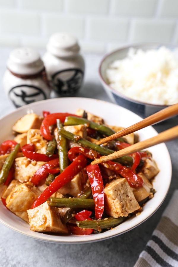 Asian Tofu Stir Fry Recipe - Easy, healthy vegetarian tofu stir fry with gooey sauce that's a little spicy. #tofurecipes #vegetarian #healthyrecipe #stirfry | pickledplum.com