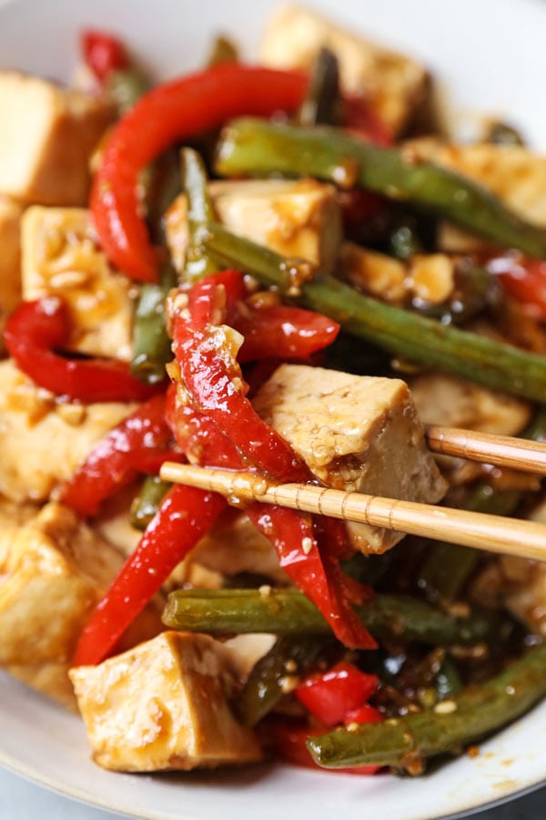 Asian Tofu Stir Fry Recipe - Easy, healthy vegetarian tofu stir fry with gooey sauce that's a little spicy. #tofurecipes #vegetarian #healthyrecipe #stirfry | pickledplum.com