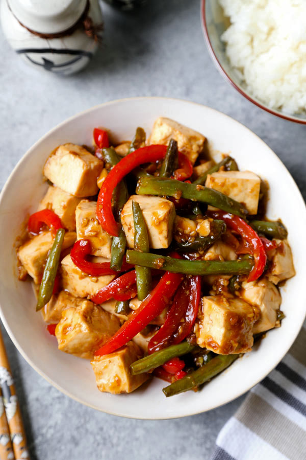 Asian Tofu Stir Fry Recipe - Easy, healthy vegetarian tofu stir fry with gooey sauce that's a little spicy. #tofurecipes #vegetarian #healthyrecipe #stirfry | pickledplum.com