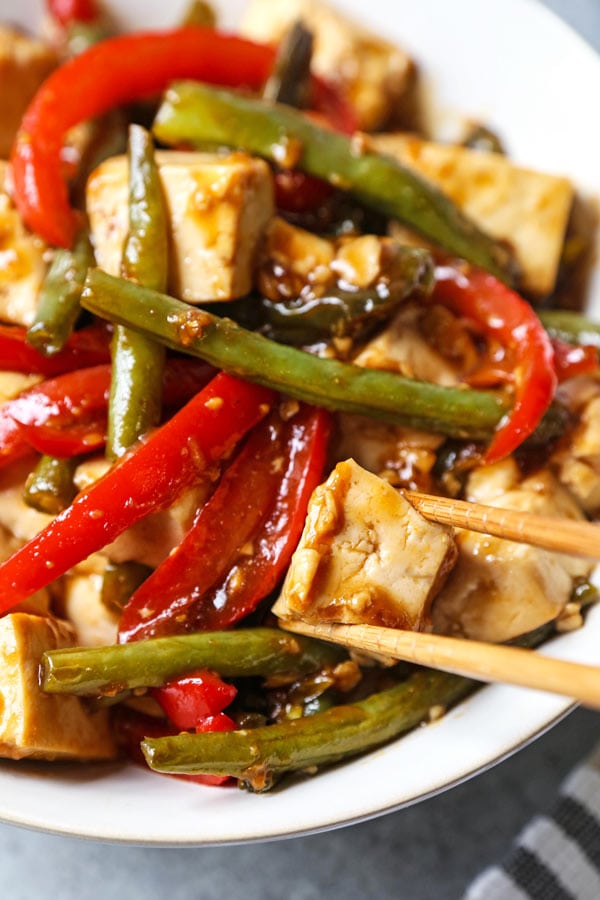 Asian Tofu Stir Fry Recipe - Easy, healthy vegetarian tofu stir fry with gooey sauce that's a little spicy. #tofurecipes #vegetarian #healthyrecipe #stirfry | pickledplum.com