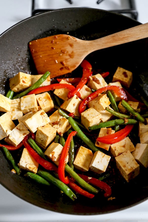 Asian Tofu Stir Fry Recipe - Easy, healthy vegetarian tofu stir fry with gooey sauce that's a little spicy. #tofurecipes #vegetarian #healthyrecipe #stirfry | pickledplum.com