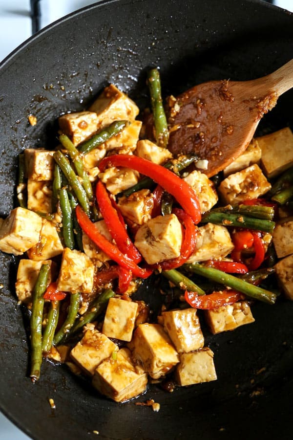 Asian Tofu Stir Fry Recipe - Easy, healthy vegetarian tofu stir fry with gooey sauce that's a little spicy. #tofurecipes #vegetarian #healthyrecipe #stirfry | pickledplum.com