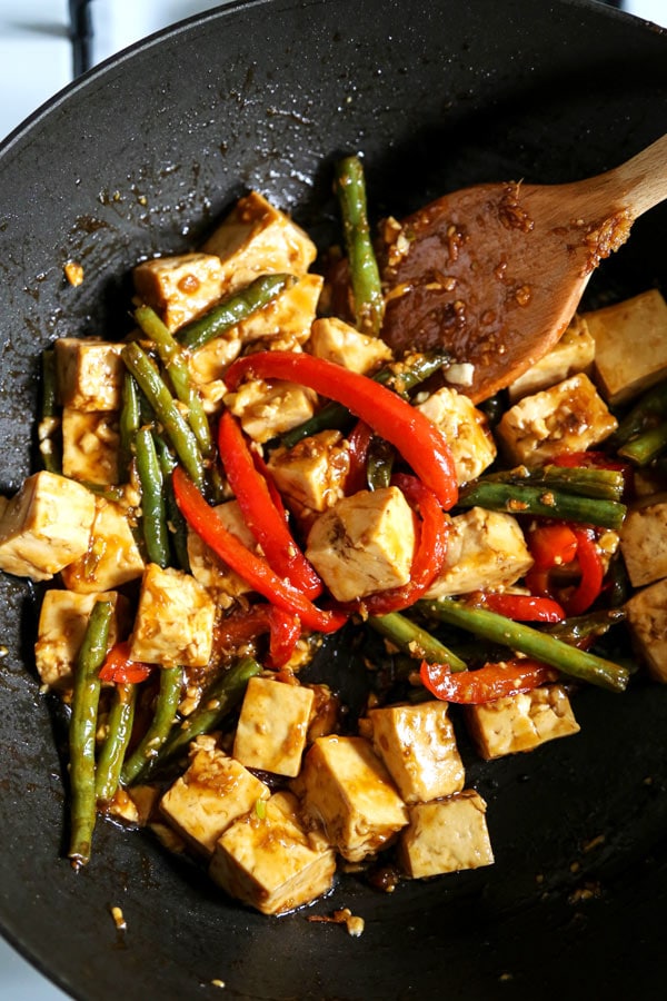 Asian Tofu Stir Fry Recipe - Easy, healthy vegetarian tofu stir fry with gooey sauce that's a little spicy. #tofurecipes #vegetarian #healthyrecipe #stirfry | pickledplum.com