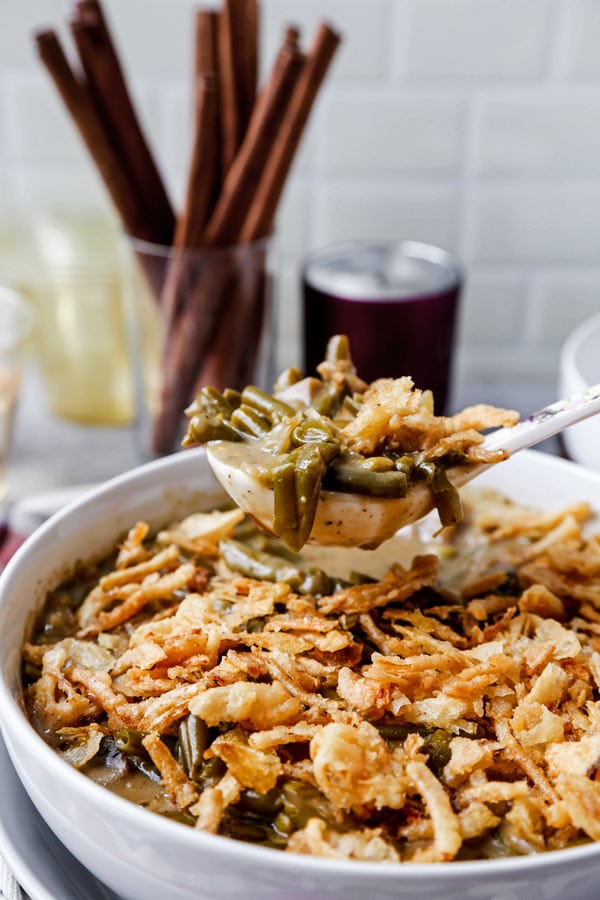 Slow Cooker Green Bean Casserole (Vegan) - A healthy holiday dinner recipe (or Thanksgiving side) that will make you fall in love with plant based foods. Mushrooms, onions and green beans slow cooked in a creamy, cheesy sauce made with nutritional yeast, flour and unsweetened almond milk. #veganrecipes #plantbased #vegetarianrecipes #thanksgivingrecipe | pickledplum.com