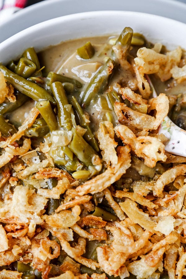 Slow Cooker Green Bean Casserole (Vegan) - A healthy holiday dinner recipe (or Thanksgiving side) that will make you fall in love with plant based foods. Mushrooms, onions and green beans slow cooked in a creamy, cheesy sauce made with nutritional yeast, flour and unsweetened almond milk. #veganrecipes #plantbased #vegetarianrecipes #thanksgivingrecipe | pickledplum.com