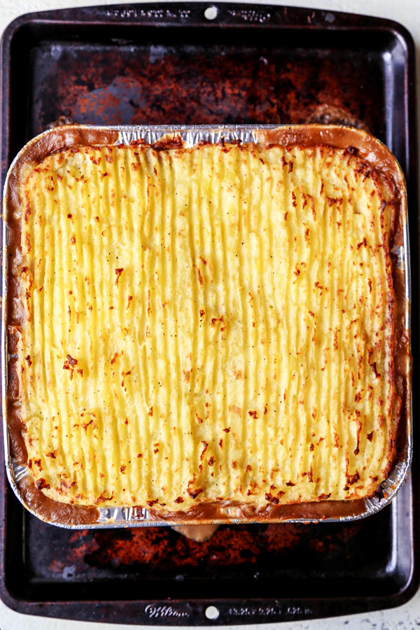 Vegan Sheperd's Pie - This is an easy mushrooms, lentils and veggie packed vegan shepherd's pie recipe that will make you forget about meat! Cooked in a mushroom gravy and topped with fluffy mashed potatoes, it's healthy comfort food done well! #veganrecipes #plantbased #vegetarianrecipes #thanksgiving #healthycomfortfood | pickledplum.com