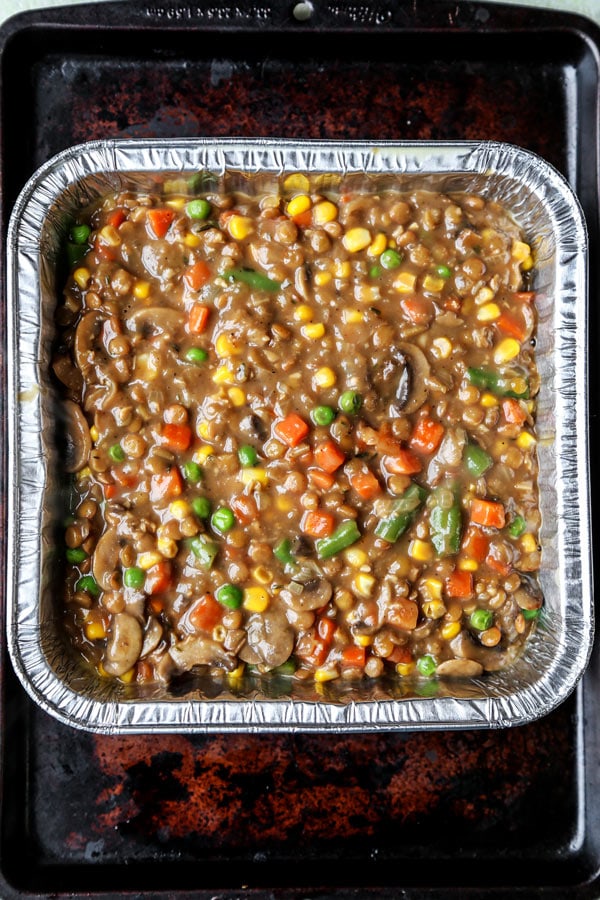 Vegan Sheperd's Pie - This is an easy mushrooms, lentils and veggie packed vegan shepherd's pie recipe that will make you forget about meat! Cooked in a mushroom gravy and topped with fluffy mashed potatoes, it's healthy comfort food done well! #veganrecipes #plantbased #vegetarianrecipes #thanksgiving #healthycomfortfood | pickledplum.com