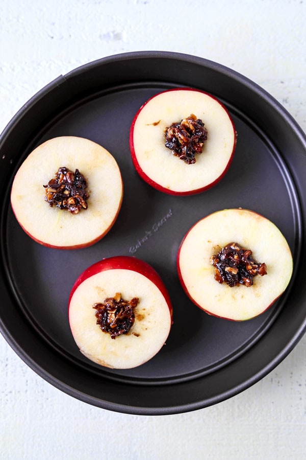 French Stuffed Baked Apples - A delicious dessert that hails from the French country side, these stuffed baked apples are sweet, tender and stuffed with nutritious ingredients. They are scrumptious! #dessertrecipes #christmasrecipes #vegetariandessert #healthydessert | pickledplum.com