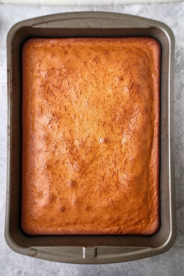 Healthier Hawaiian Butter Mochi Recipe - Hawaiian butter mochi is a sweet, chewy and stretchy dessert that's impossible to resist! I've substituted the butter for olive oil and some of the sugar for honey to add a floral note to this classic Hawaiian recipe.  #dessertrecipes #snacks #sweets | pickledplum.com