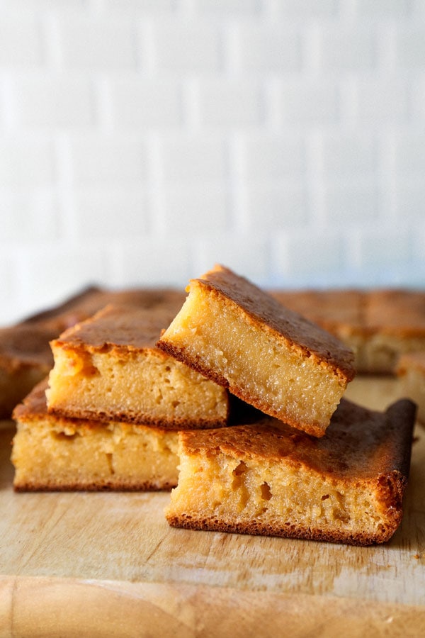 Healthier Hawaiian Butter Mochi Recipe - Hawaiian butter mochi is a sweet, chewy and stretchy dessert that's impossible to resist! I've substituted the butter for olive oil and some of the sugar for honey to add a floral note to this classic Hawaiian recipe.  #dessertrecipes #snacks #sweets | pickledplum.com