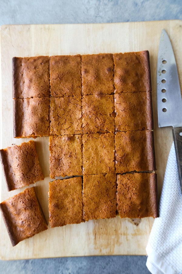 Healthier Hawaiian Butter Mochi Recipe - Hawaiian butter mochi is a sweet, chewy and stretchy dessert that's impossible to resist! I've substituted the butter for olive oil and some of the sugar for honey to add a floral note to this classic Hawaiian recipe.  #dessertrecipes #snacks #sweets | pickledplum.com