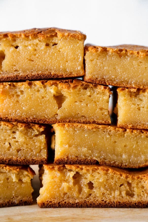 Healthier Hawaiian Butter Mochi Recipe - Hawaiian butter mochi is a sweet, chewy and stretchy dessert that's impossible to resist! I've substituted the butter for olive oil and some of the sugar for honey to add a floral note to this classic Hawaiian recipe.  #dessertrecipes #snacks #sweets | pickledplum.com