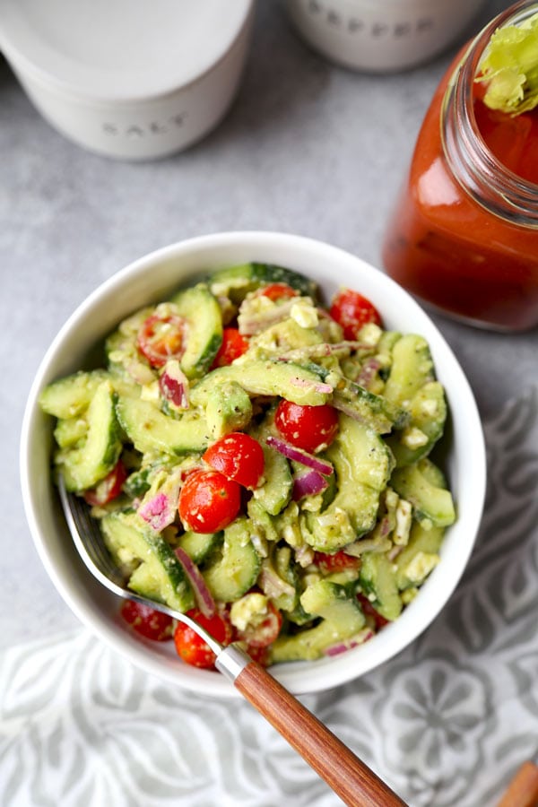 This bright and Creamy Cucumber Tomato Salad has the garden fresh taste of summer. Serve it at your Super Bowl party - or bring it to your next backyard cookout! #vegetariansalad #healthyrecipes #cucumbersalad #glutenfreesalad | pickledplum.com