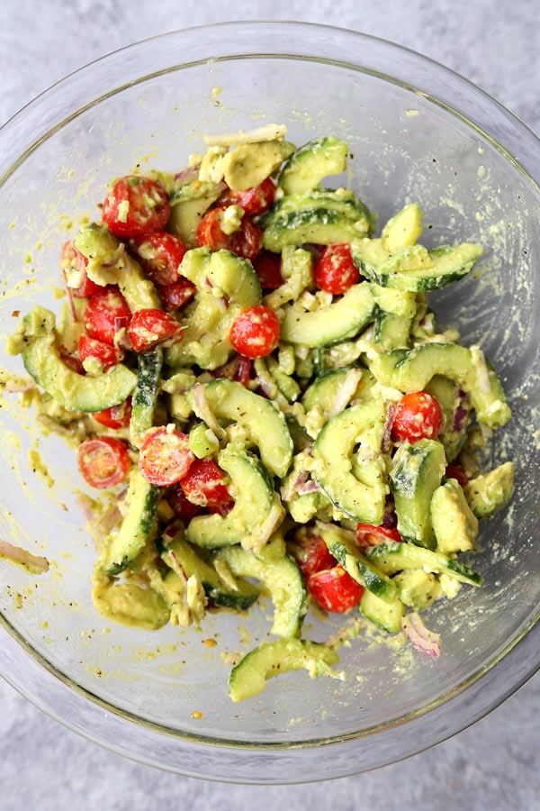 This bright and Creamy Cucumber Tomato Salad has the garden fresh taste of summer. Serve it at your Super Bowl party - or bring it to your next backyard cookout! #vegetariansalad #healthyrecipes #cucumbersalad #glutenfreesalad | pickledplum.com