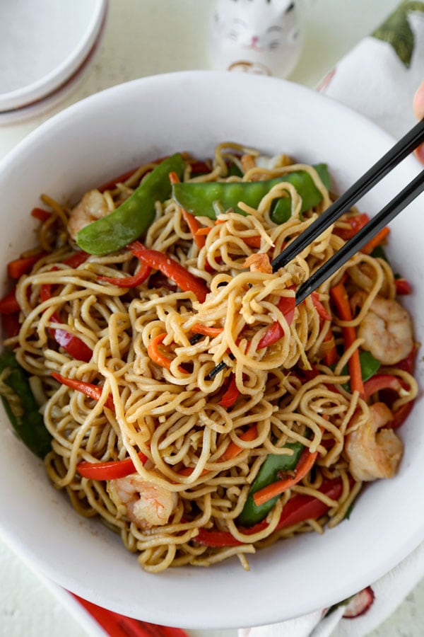 Shrimp lo mein is an easy Chinese recipe anyone can make at home! Use cabbage and your favorite veggies and stir fry them with egg noodles and an authentic lo mein sauce. Delicious! #pfchangs #stirfry #shrimprecipe #chinesefood | pickledplum.com