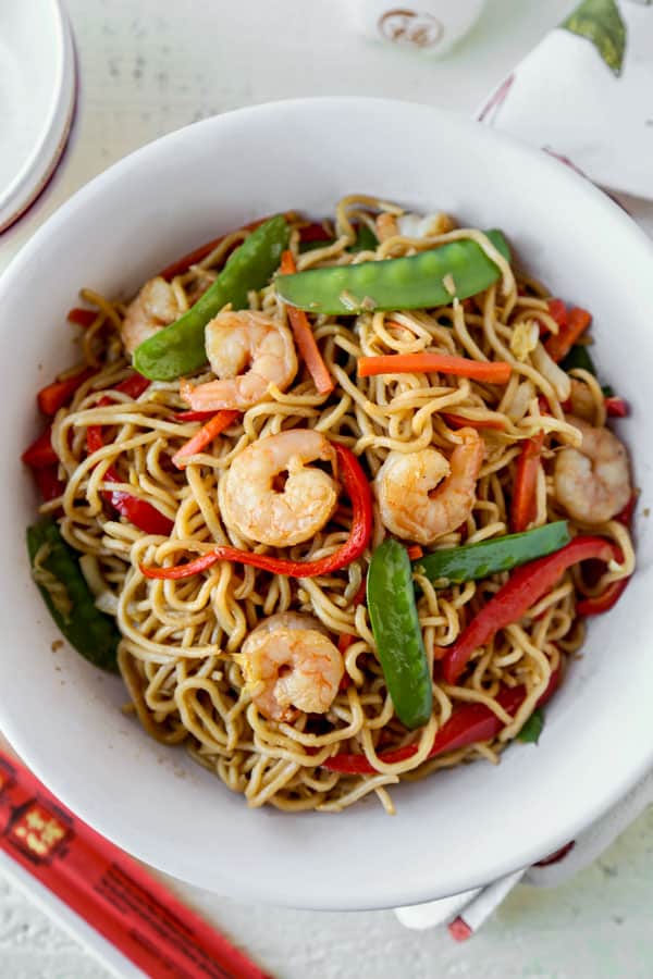 Shrimp lo mein is an easy Chinese recipe anyone can make at home! Use cabbage and your favorite veggies and stir fry them with egg noodles and an authentic lo mein sauce. Delicious! #pfchangs #stirfry #shrimprecipe #chinesefood | pickledplum.com