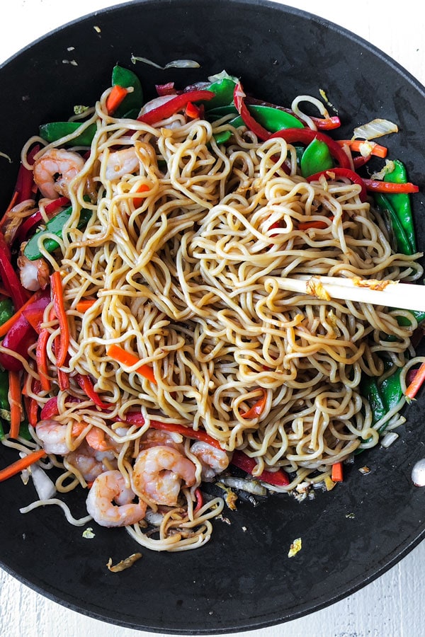 Shrimp lo mein is an easy Chinese recipe anyone can make at home! Use cabbage and your favorite veggies and stir fry them with egg noodles and an authentic lo mein sauce. Delicious! #pfchangs #stirfry #shrimprecipe #chinesefood | pickledplum.com