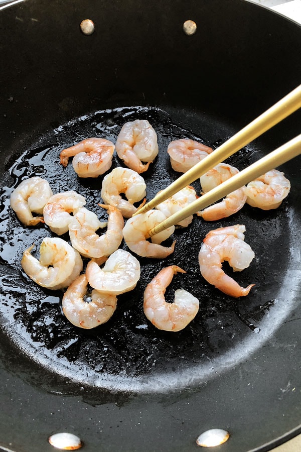 Shrimp lo mein is an easy Chinese recipe anyone can make at home! Use cabbage and your favorite veggies and stir fry them with egg noodles and an authentic lo mein sauce. Delicious! #pfchangs #stirfry #shrimprecipe #chinesefood | pickledplum.com