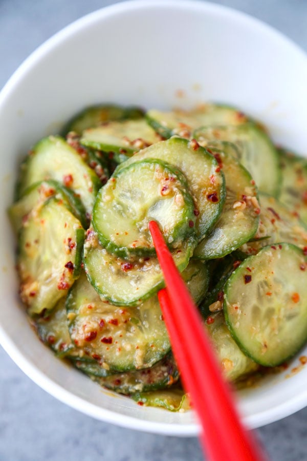 Pickled cucumbers are so versatile and delicious! They pair well with salads, sandwiches, mains and can be served as a side dish or a snack. And the best part? They only take 5-10 minutes to make and 30 minutes to marinate! Here are some of my favorite cucumber pickle recipes! #asian #vinegar #pickles #howtomake | pickledplum.com