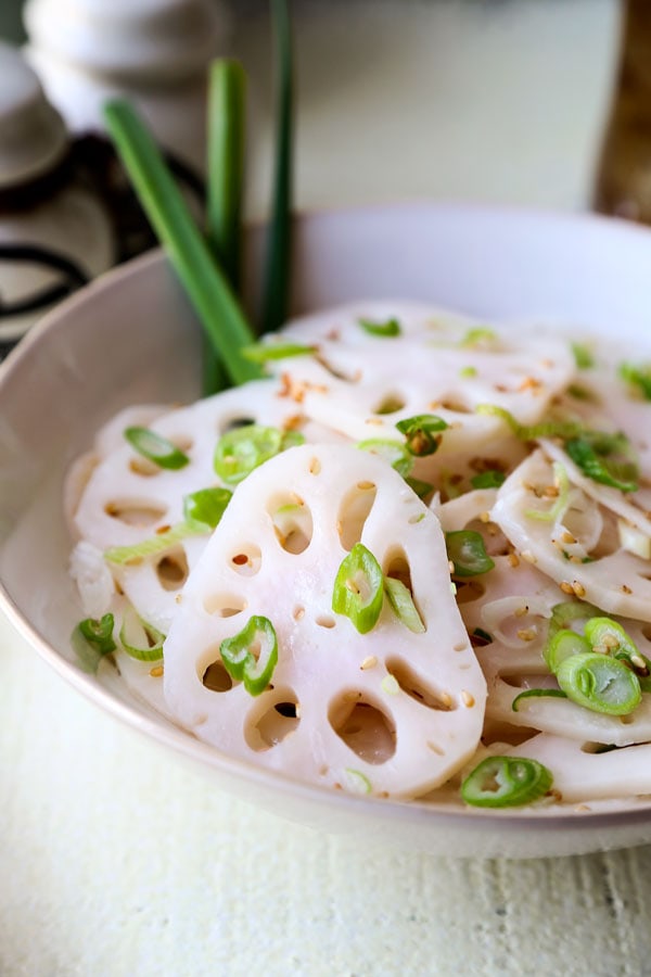 Chinese Lotus Root Salad - What a looker! Not only is this bright and cleansing Chinese Lotus Root Salad packed with goodness, it’s a beautiful addition to the dinner table. Ready in 15 minutes! #recipe #lotusroot #benefits #veganrecipes #vegetarianrecipes #veganchinese #sidedish | pickledplum.com