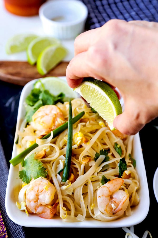 Classic Pad Thai - Ready for some stir fried noodle action? This Classic Pad Thai Recipe is a taste of Thailand. Best part: you can make these Thai noodles at home in 21 minutes! #thaifood #stirfry #asianrecipe #padthai | pickledplum.com