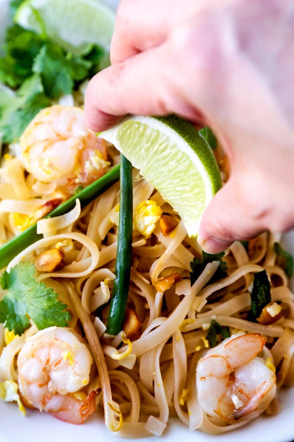 Classic Pad Thai - Ready for some stir fried noodle action? This Classic Pad Thai Recipe is a taste of Thailand. Best part: you can make these Thai noodles at home in 21 minutes! #thaifood #stirfry #asianrecipe #padthai | pickledplum.com