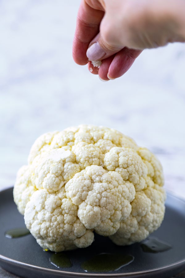 Whole Roasted Cauliflower Head - My favorite cauliflower recipe of all time! With only 3 ingredients needed and 5 minutes of prepping, little effort is required to making this dish - and it always gets the seal of approval! #veganrecipe #vegetarianrecipes #glutenfreerecipes #veggies #bakedcauliflower #keto | pickledplum.com