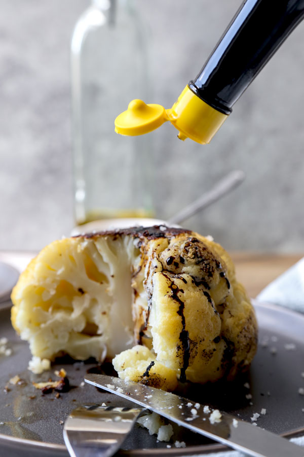 Whole Roasted Cauliflower Head - My favorite cauliflower recipe of all time! With only 3 ingredients needed and 5 minutes of prepping, little effort is required to making this dish - and it always gets the seal of approval! #veganrecipe #vegetarianrecipes #glutenfreerecipes #veggies #bakedcauliflower #keto | pickledplum.com