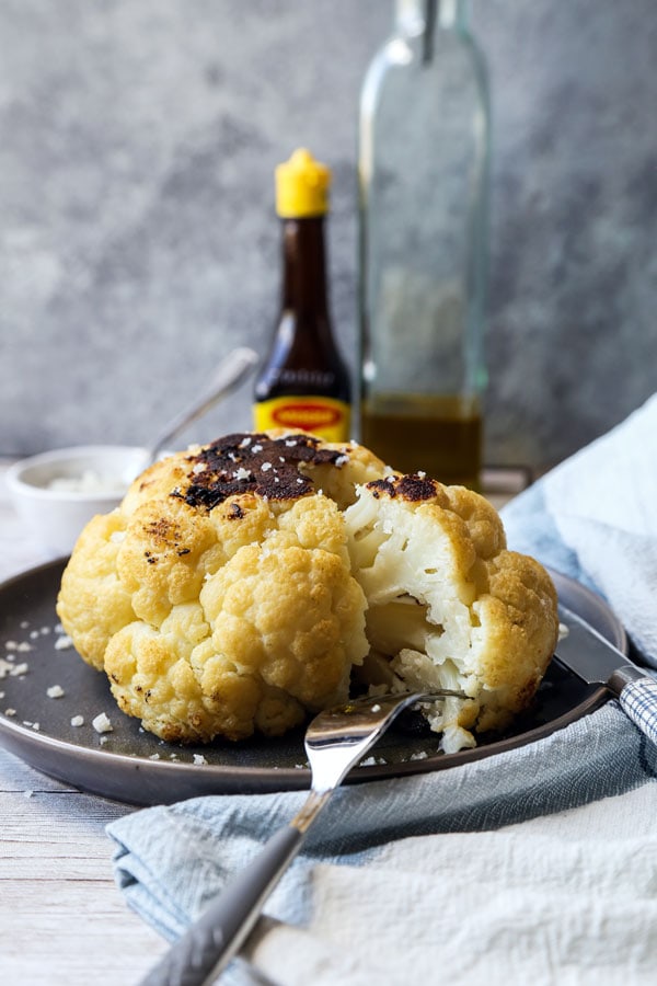 Whole Roasted Cauliflower Head - My favorite cauliflower recipe of all time! With only 3 ingredients needed and 5 minutes of prepping, little effort is required to making this dish - and it always gets the seal of approval! #veganrecipe #vegetarianrecipes #glutenfreerecipes #veggies #bakedcauliflower #keto | pickledplum.com