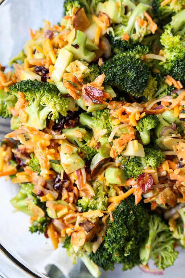 Tossed salad with broccoli florets, shredded carrot, almonds, cranberries and cheese