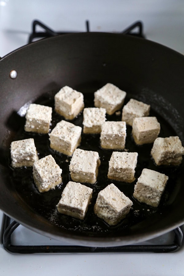 Dusted tofu in a pan