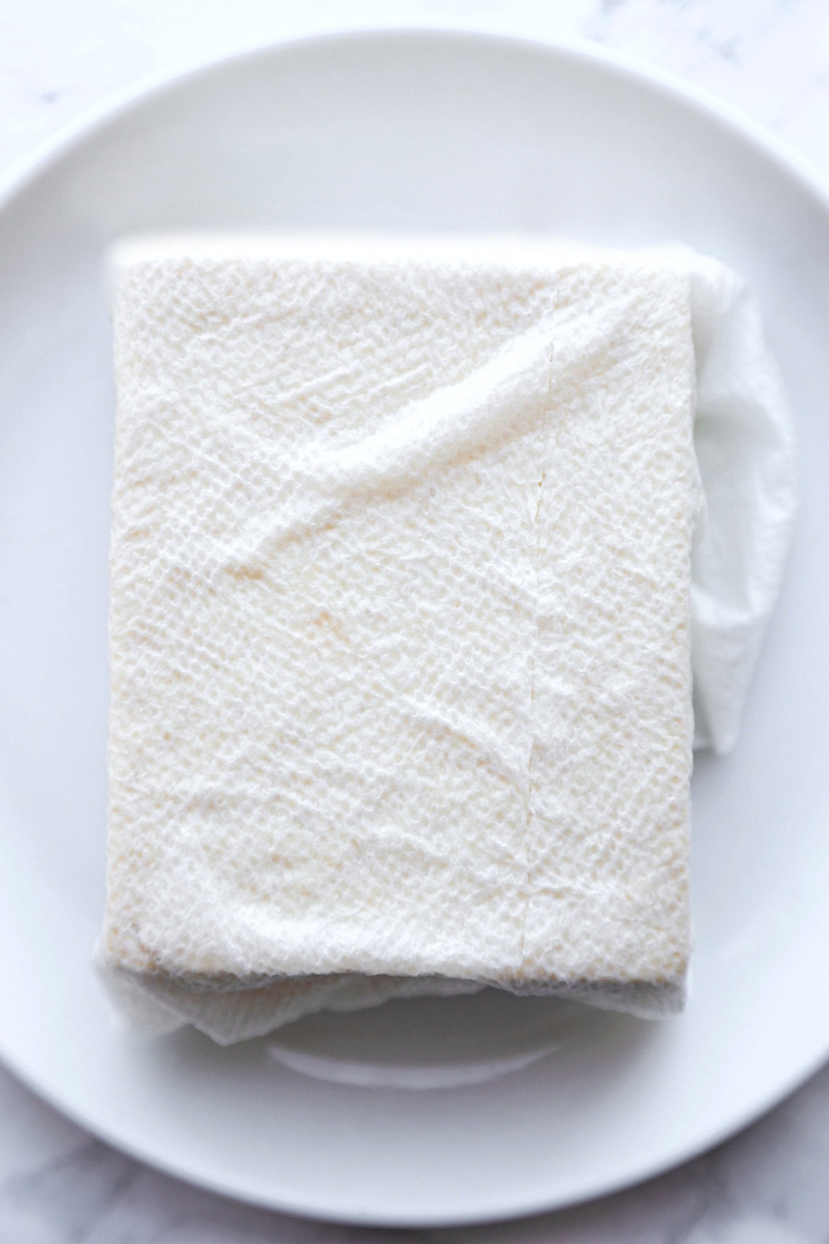 tofu wrapped in paper towel