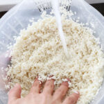 Washing sjort grain Japanese rice in a rice rinsing bowl