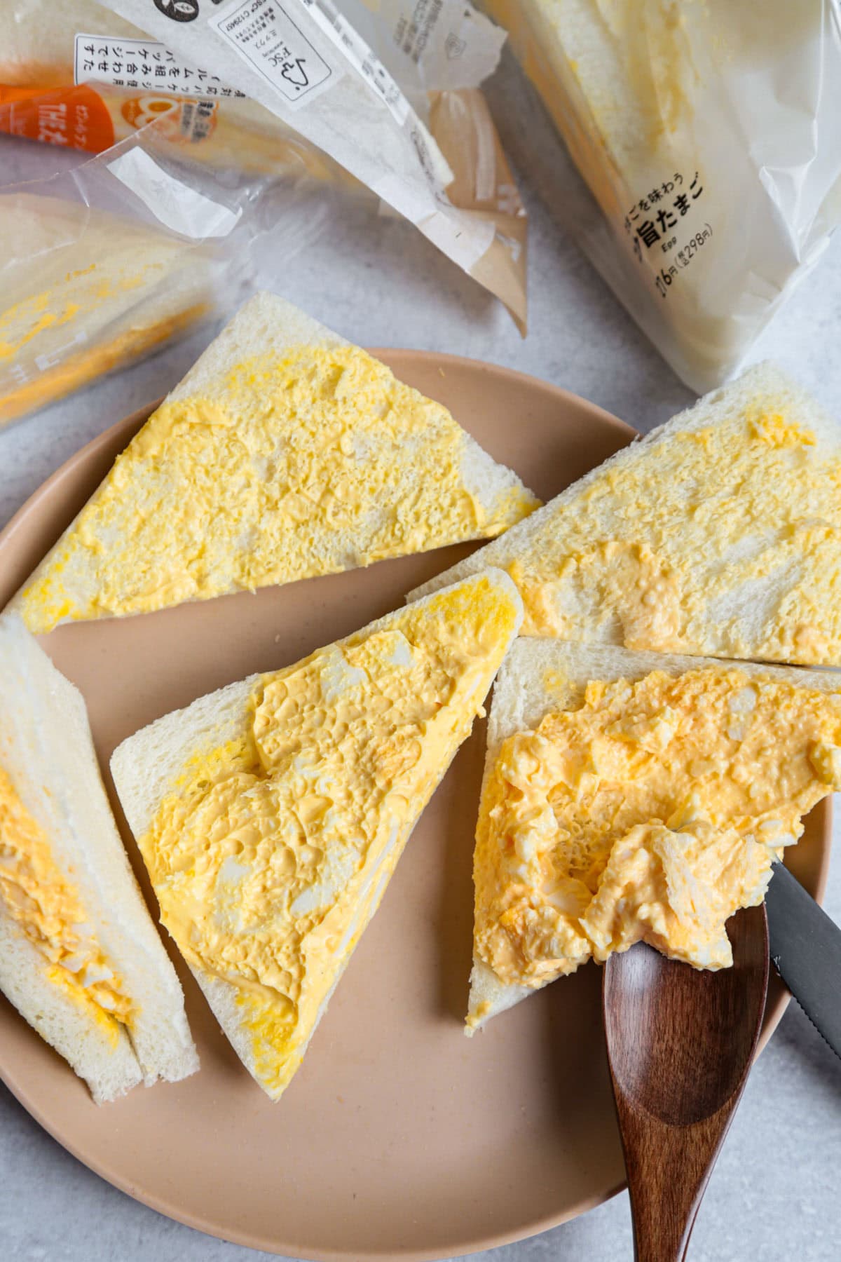 Conbini egg sandwiches open with creamy egg interior