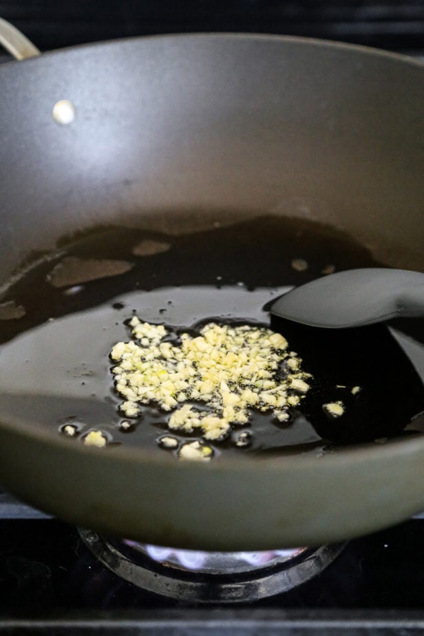 garlic frying in a pan
