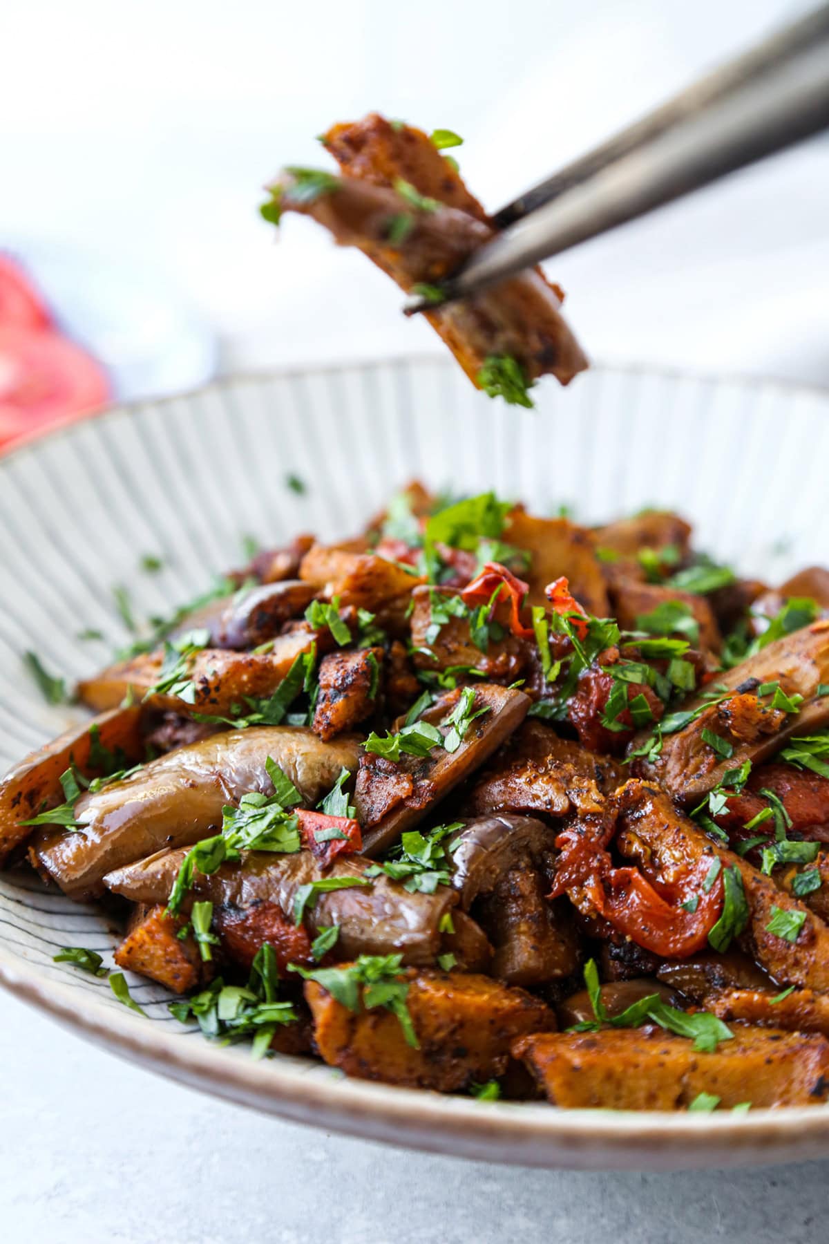 Stir fried eggplant and seitan with garlic and tomato