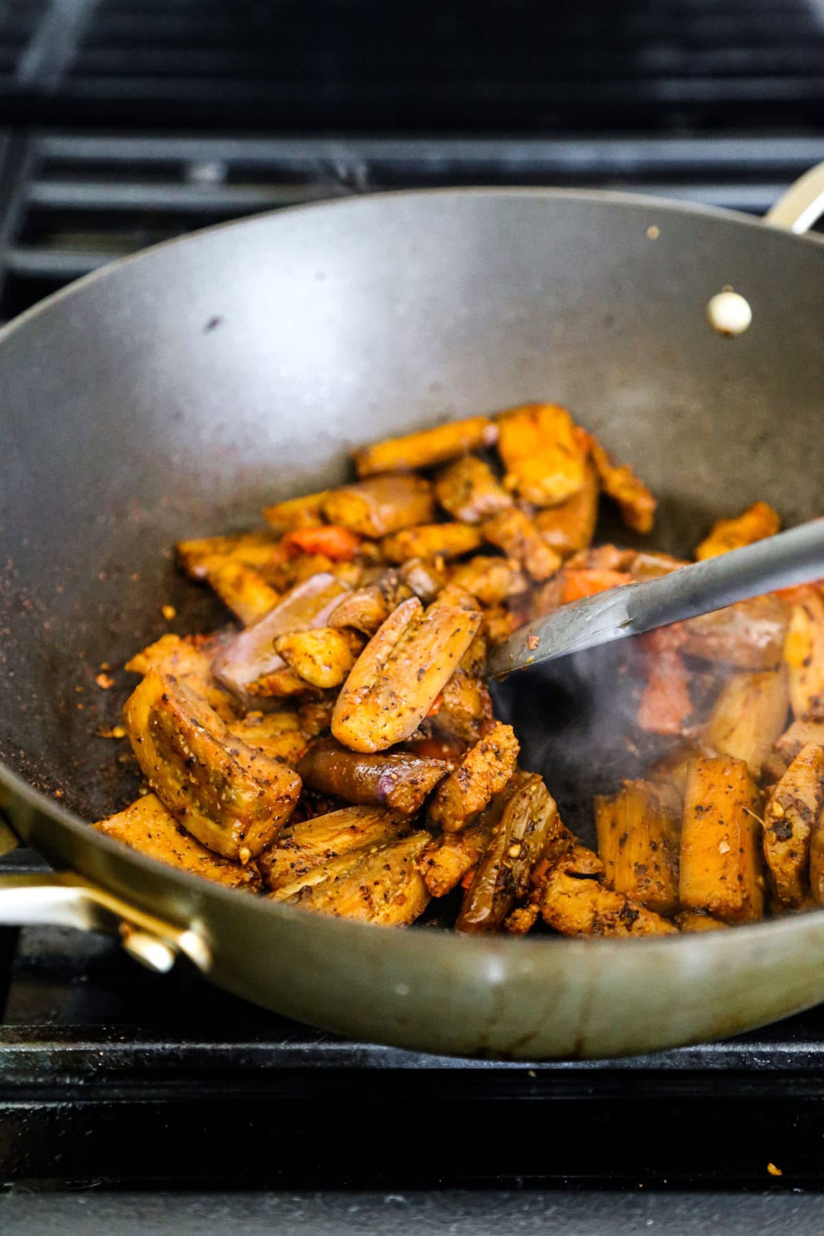 Stir fried eggplant and seitan with garlic and tomato