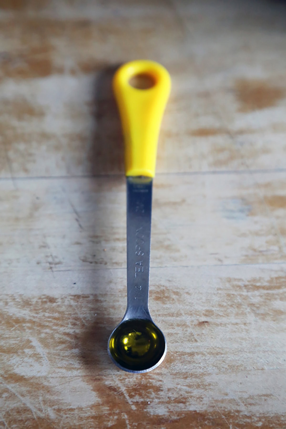 spoon with olive oil