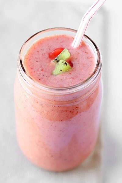 Bright skin fruit smoothie with banana, strawberries and kiwi