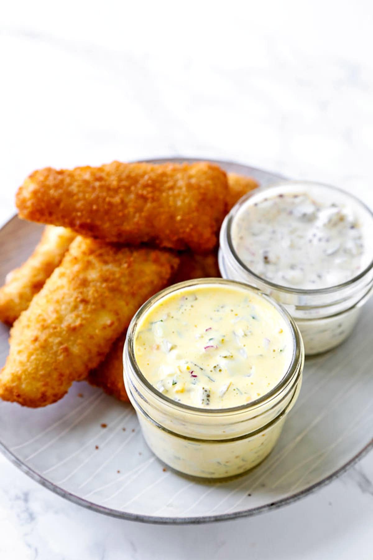 fried fish with two types of tartar sauce. American tartar sauce and Japanese tartar sauce