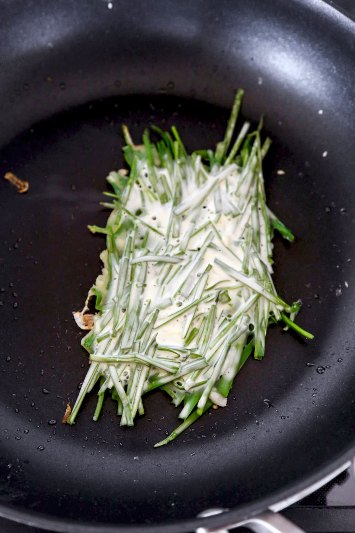 chive pancake in skillet