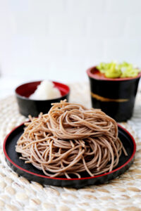 Cooked soba noodles with tsuyu, daikon and scallions - zaru soba
