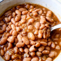 Slow Cooker Pinto Beans - The easiest, tastiest way to make beans! This is a healthy, easy vegetarian, vegan and gluten free pinto beans recipe using chili powder, and a medley of dried spices. Simple cooking that your entire family will love! #comfortfoods #vegetarian #vegan #glutenfree #slowcookerrecipes | pickledplum.com