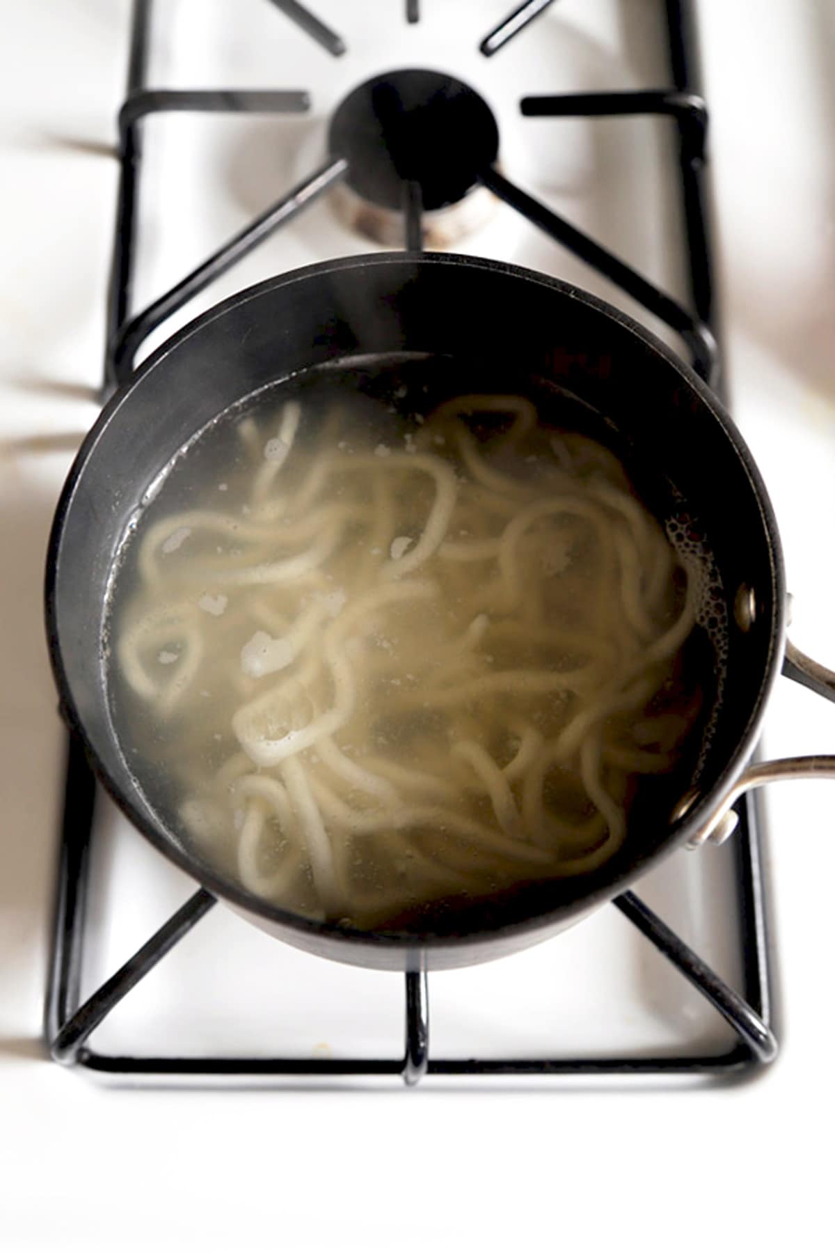 udon noodles in boiling water