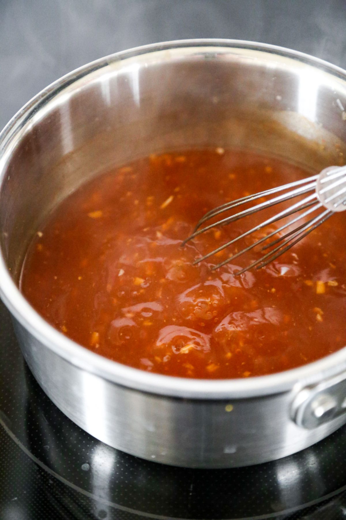 sauce boiling in saucepan