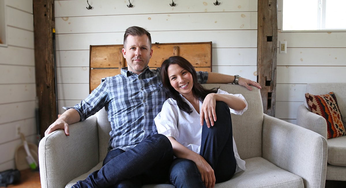 Caroline Phelps and Ben Phelps of Pickled Plum sitting on a loveseat