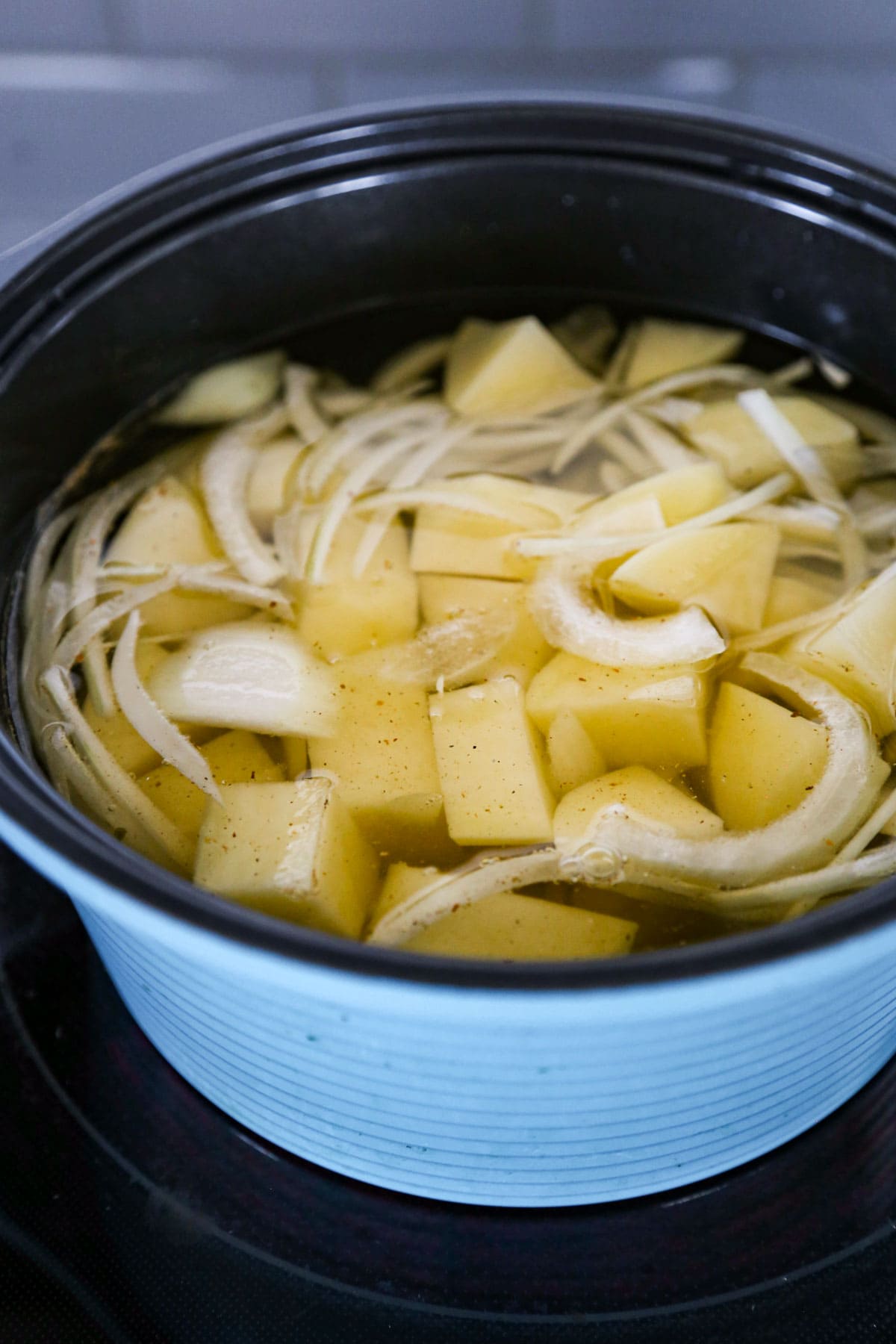 Potatoes and onions in broth