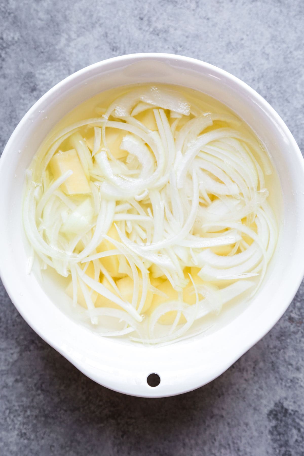 sliced onions and potatoes