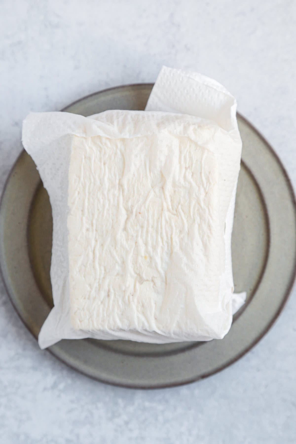 Firm tofu wrapped in paper towel