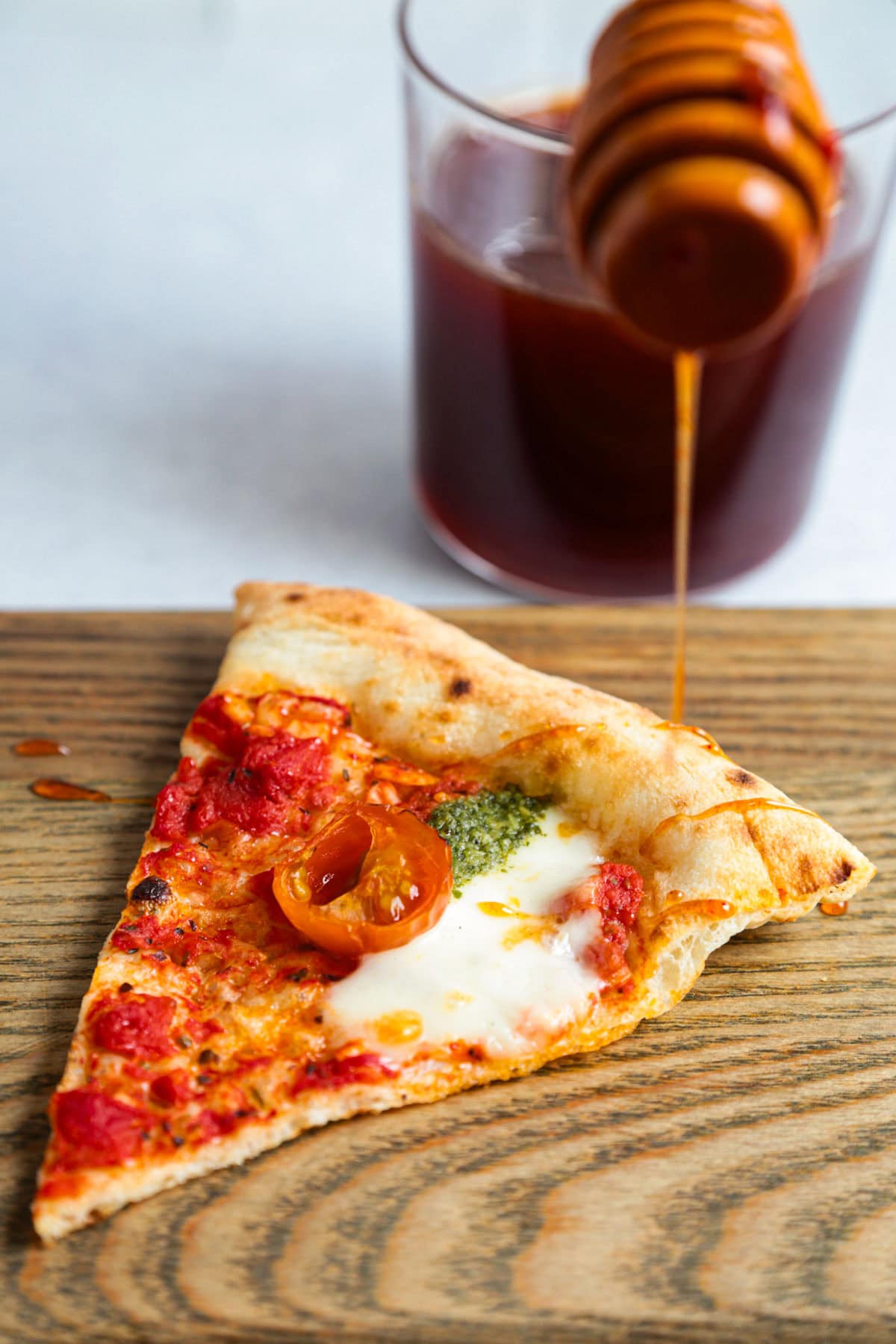 pizza slice with gochujang hot honey